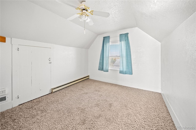 bonus room featuring carpet flooring, lofted ceiling, a textured ceiling, and a baseboard heating unit