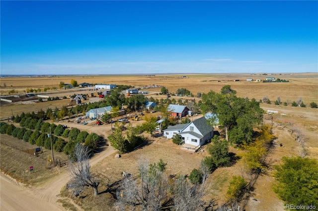 birds eye view of property with a rural view