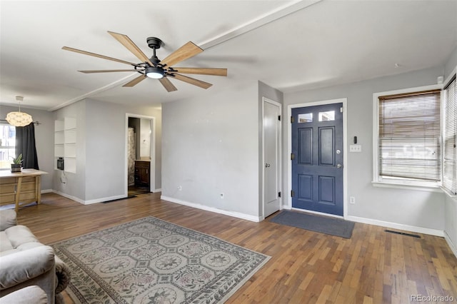 1917 E Cache La Poudre St, Colorado Springs, CO 80909 - foyer featuring baseboards, ceiling fan, wood finished floors, and visible vents