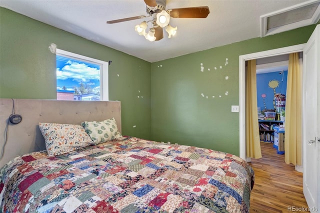 1917 E Cache La Poudre St, Colorado Springs, CO 80909 - bedroom featuring ceiling fan, wood finished floors, and attic access