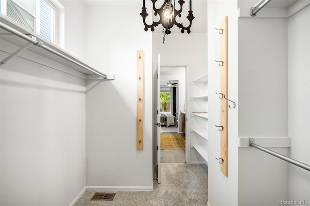 1947 King St, Denver, CO 80204 - spacious closet featuring carpet floors and a chandelier
