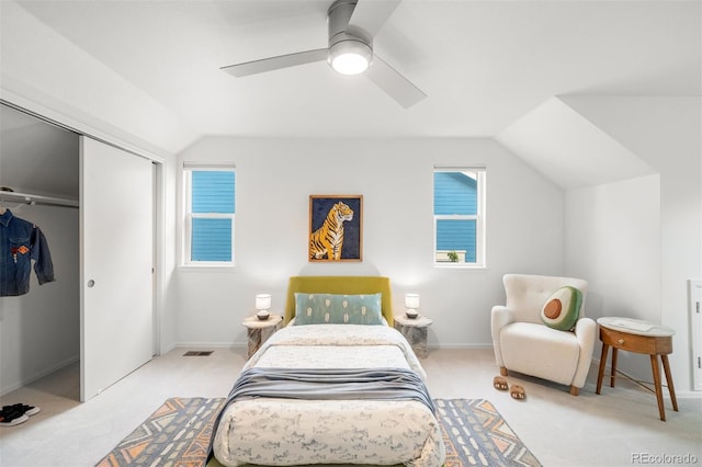 1947 King St, Denver, CO 80204 - carpeted bedroom with lofted ceiling, a closet, multiple windows, ceiling fan, and baseboards