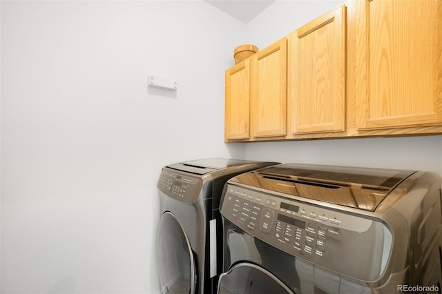 1947 King St, Denver, CO 80204 - laundry area featuring cabinet space and separate washer and dryer