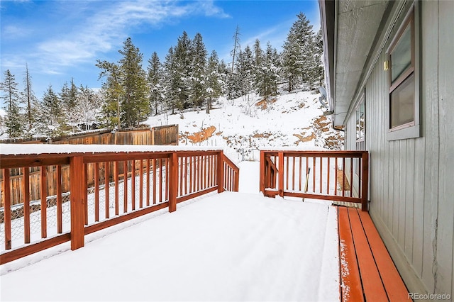 view of snow covered deck