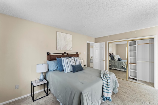 4901 Pioneer Rd, Pueblo, CO 81008 - carpeted bedroom with a textured ceiling, baseboards, and a closet