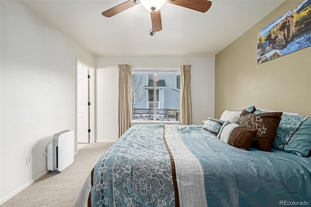 bedroom featuring ceiling fan and light carpet