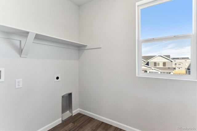 clothes washing area featuring laundry area, dark wood-style floors, baseboards, and hookup for an electric dryer