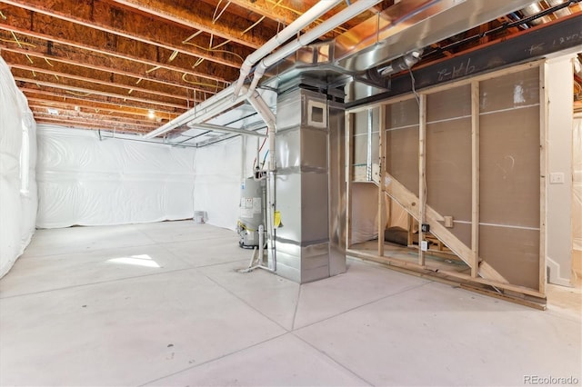 unfinished basement featuring water heater