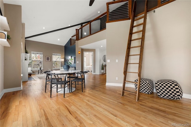 dining area featuring baseboards, light wood finished floors, and recessed lighting