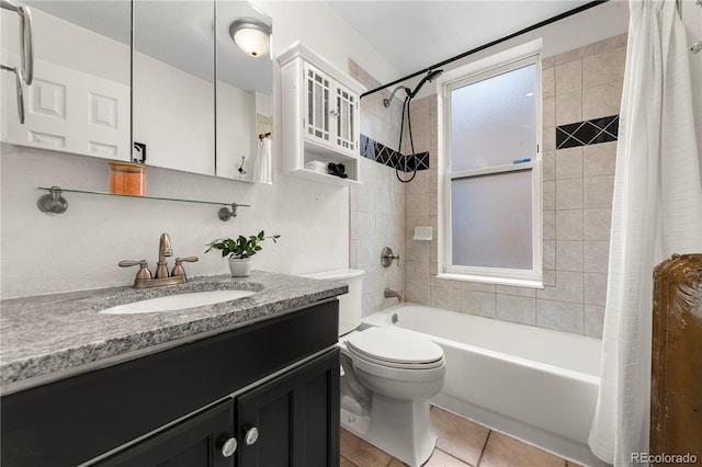 full bath with shower / bath combination with curtain, tile patterned floors, vanity, and toilet