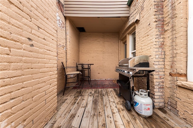 wooden deck with area for grilling
