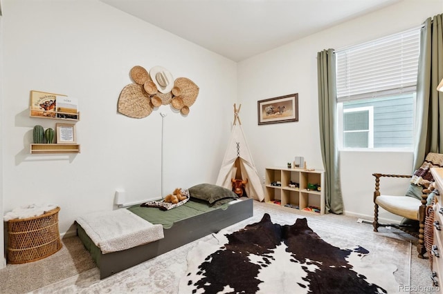 bedroom featuring baseboards