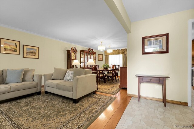 1091 E Pinewood Ave, Centennial, CO 80121 - living area featuring a chandelier, light wood-style flooring, and ornamental molding