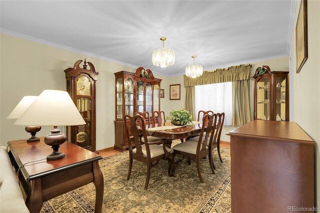 1091 E Pinewood Ave, Centennial, CO 80121 - dining area featuring a chandelier, ornamental molding, and wood finished floors