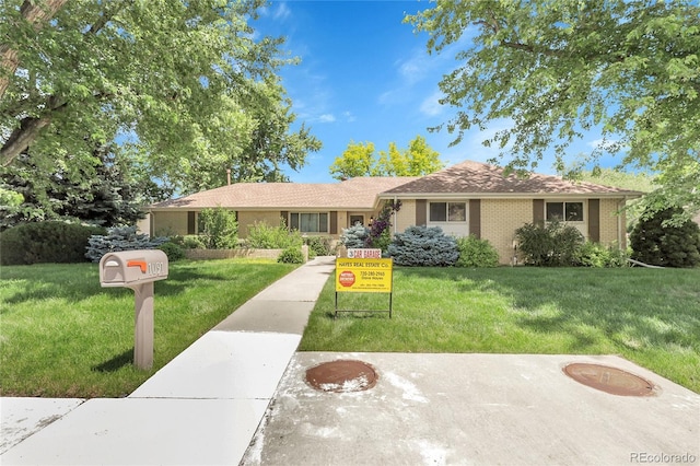 1091 E Pinewood Ave, Centennial, CO 80121 - single story home with a front yard and brick siding