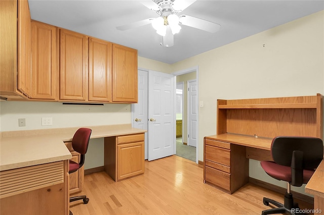 1091 E Pinewood Ave, Centennial, CO 80121 - office area with built in study area, light wood-style floors, and ceiling fan