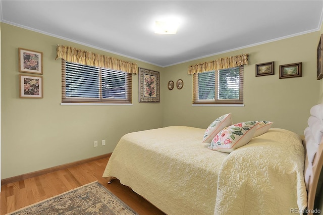 1091 E Pinewood Ave, Centennial, CO 80121 - bedroom featuring wood finished floors and ornamental molding