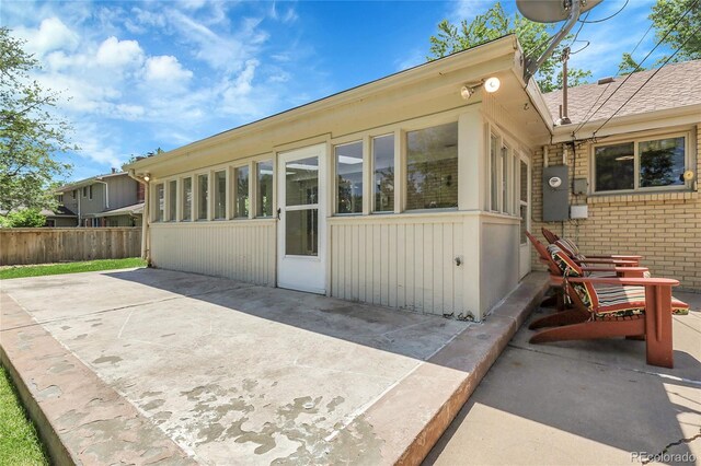 1091 E Pinewood Ave, Centennial, CO 80121 - rear view of property with a patio and brick siding