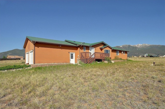 30870 County Road 356, Buena Vista, CO 81211 - back of house with a deck with mountain view and a garage