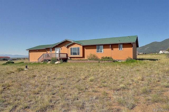 30870 County Road 356, Buena Vista, CO 81211 - view of front of property with a deck with mountain view and a metal roof