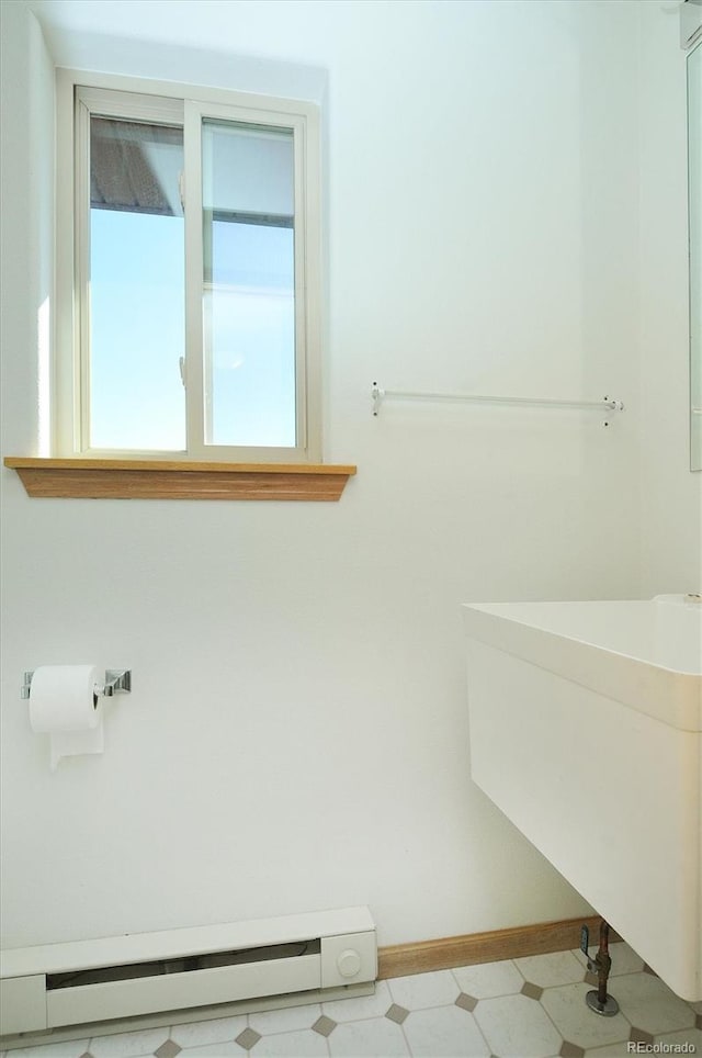 30870 County Road 356, Buena Vista, CO 81211 - bathroom featuring a baseboard radiator, healthy amount of natural light, and tile patterned floors