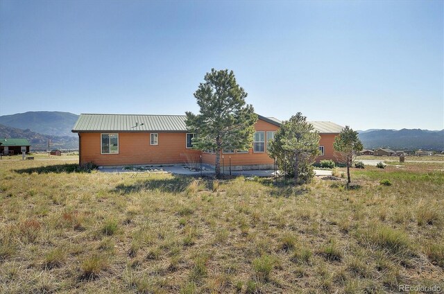 30870 County Road 356, Buena Vista, CO 81211 - view of property exterior featuring a mountain view and a metal roof