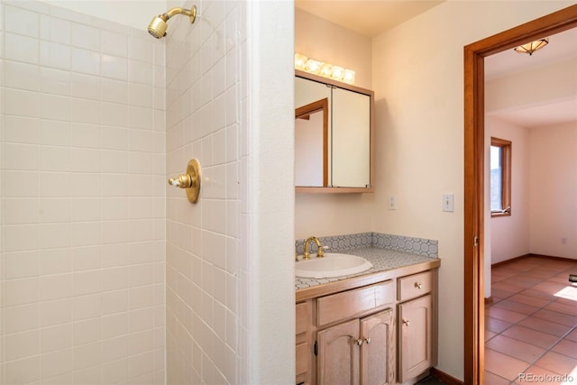 bathroom with tile patterned flooring and vanity