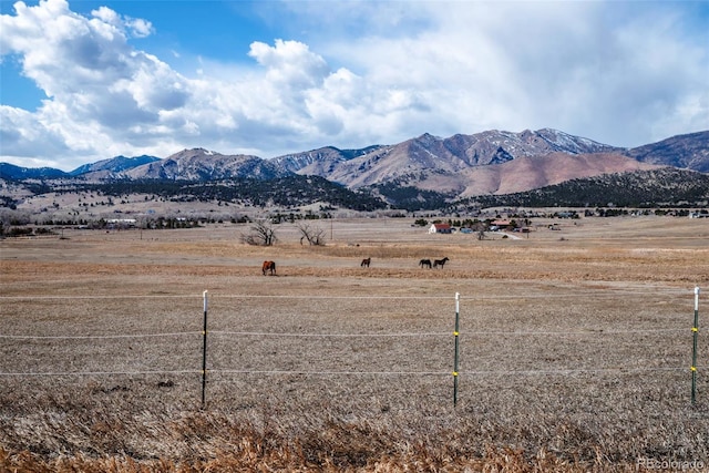 mountain view featuring a rural view