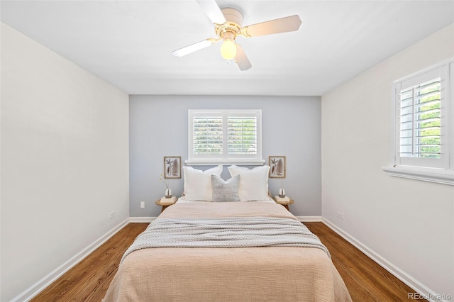 2047 S Milwaukee St Unit 4, Denver, CO 80210 - bedroom with baseboards, a ceiling fan, and wood finished floors