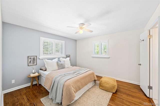 2047 S Milwaukee St Unit 4, Denver, CO 80210 - bedroom with baseboards, a ceiling fan, and wood finished floors