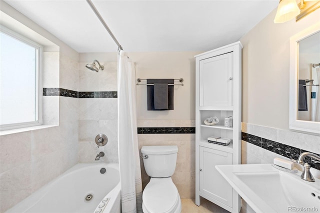 2047 S Milwaukee St Unit 4, Denver, CO 80210 - full bath featuring tile walls, wainscoting, shower / bath combo, a sink, and toilet
