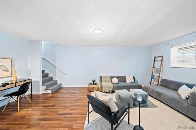 2047 S Milwaukee St Unit 4, Denver, CO 80210 - living room with stairway, baseboards, and wood finished floors