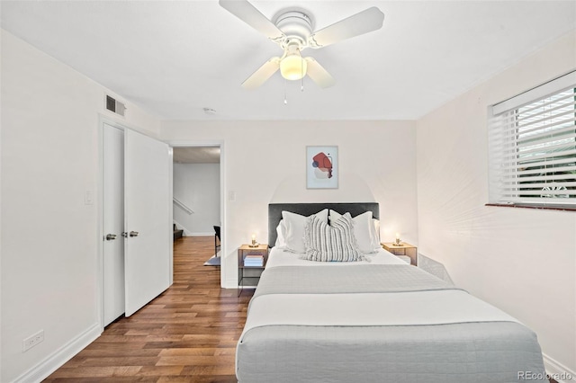 2047 S Milwaukee St Unit 4, Denver, CO 80210 - bedroom featuring ceiling fan, baseboards, visible vents, and wood finished floors