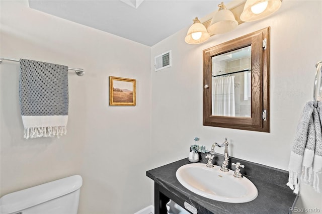2047 S Milwaukee St Unit 4, Denver, CO 80210 - full bathroom featuring vanity, toilet, a shower with curtain, and visible vents