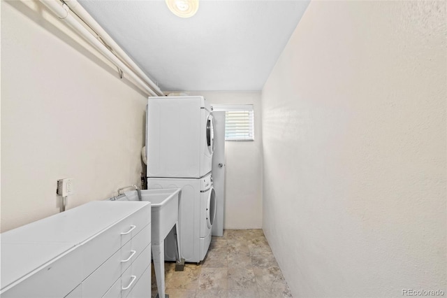 2047 S Milwaukee St Unit 4, Denver, CO 80210 - laundry area featuring stacked washing maching and dryer, laundry area, and stone finish flooring