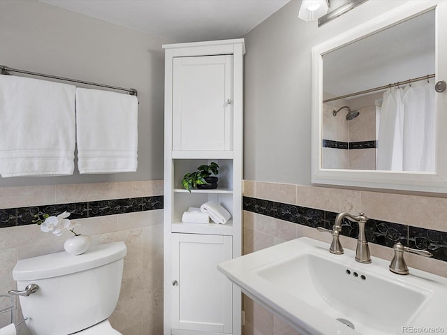 2047 S Milwaukee St Unit 4, Denver, CO 80210 - full bathroom featuring tile walls, a wainscoted wall, and a shower with shower curtain