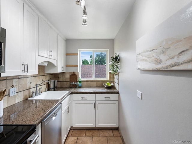 2047 S Milwaukee St Unit 4, Denver, CO 80210 - kitchen with appliances with stainless steel finishes, tile counters, backsplash, and white cabinets