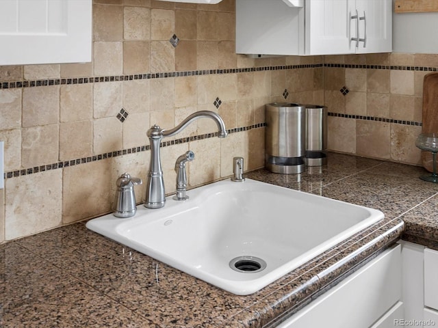 2047 S Milwaukee St Unit 4, Denver, CO 80210 - kitchen view of tile countertops, white cabinets, and tasteful backsplash