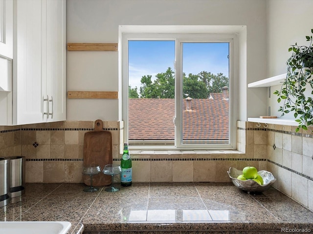 2047 S Milwaukee St Unit 4, Denver, CO 80210 - kitchen with tile countertops, open shelves, tasteful backsplash, and white cabinets