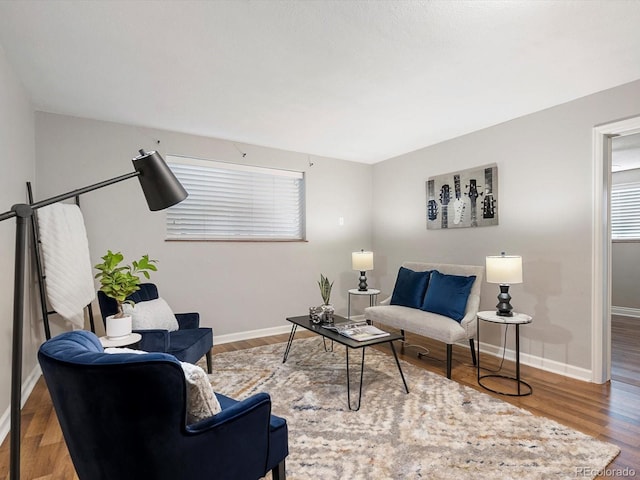 2047 S Milwaukee St Unit 4, Denver, CO 80210 - living area featuring wood finished floors and healthy amount of natural light