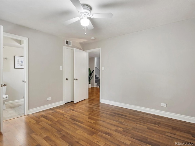 2047 S Milwaukee St Unit 4, Denver, CO 80210 - unfurnished bedroom with wood finished floors, ensuite bathroom, and ceiling fan