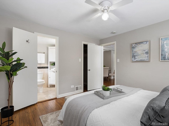 2047 S Milwaukee St Unit 4, Denver, CO 80210 - bedroom with wood finished floors, ensuite bath, and ceiling fan