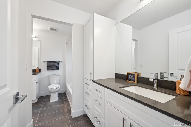 full bathroom with toilet, vanity, tile patterned flooring, and shower / washtub combination