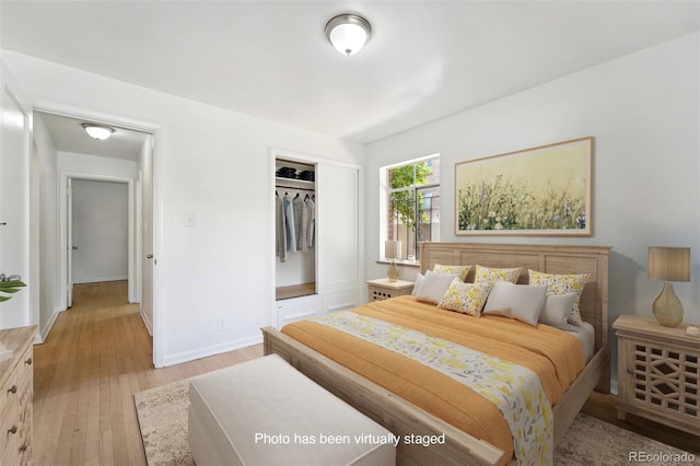 bedroom featuring light hardwood / wood-style floors and a closet