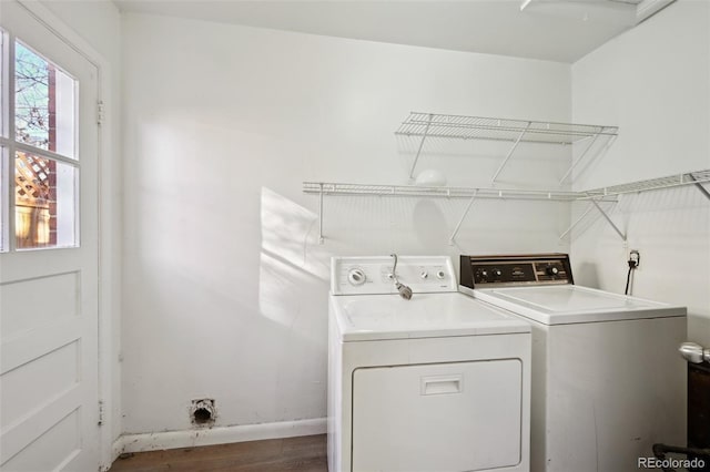 laundry area featuring dark wood-type flooring and washer and dryer