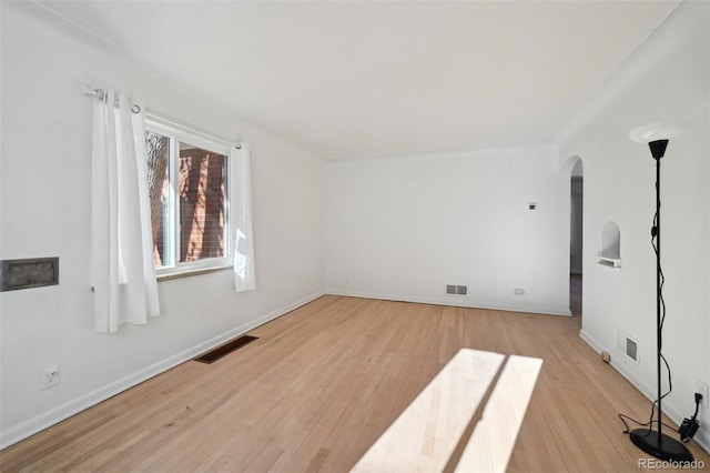 unfurnished room featuring light hardwood / wood-style flooring