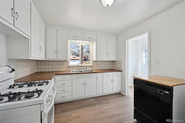 kitchen with sink, gas range gas stove, black dishwasher, light hardwood / wood-style floors, and white cabinets