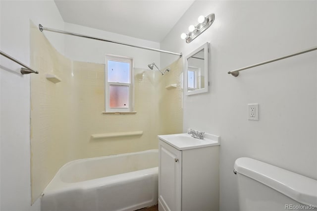 full bathroom featuring vanity, tiled shower / bath combo, and toilet