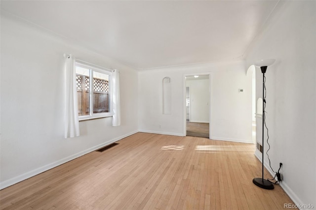 empty room with light hardwood / wood-style floors