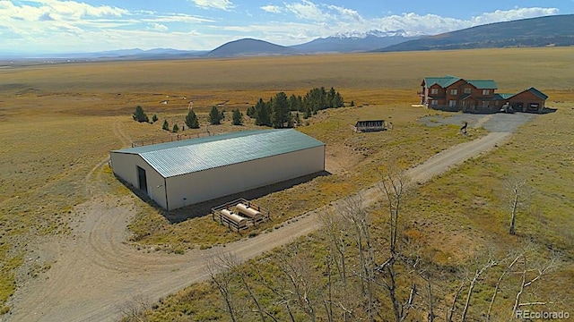 drone / aerial view with a mountain view and a rural view